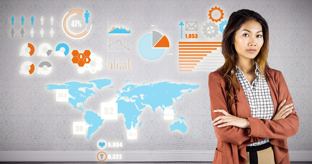 Businesswoman with crossed arms against room with wooden floorの写真素材