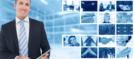 Businessman using tablet pc against modern room overlooking cityの写真素材