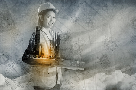 Casual businesswoman with arms crossed against architect background
