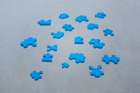 jigsaw pieces against grey vignetteの写真素材