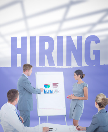 Manager presenting statistics to his colleagues against hiringの写真素材