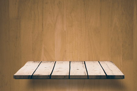 Wooden shelf against wooden wallの写真素材