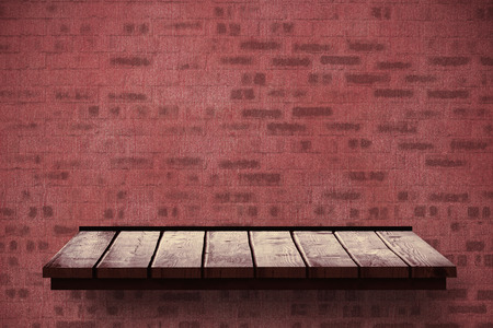 Wooden shelf against bricks wallの写真素材