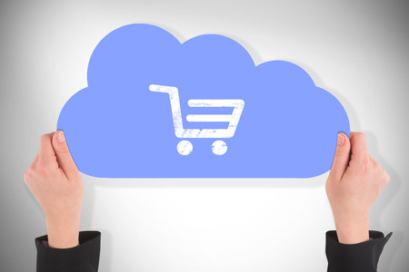 Hand holding cloud against white background with vignetteの写真素材