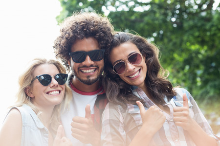 Group of friends giving thumbs up