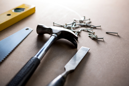 Tools and equipment used for carpentry in a dusty workshop