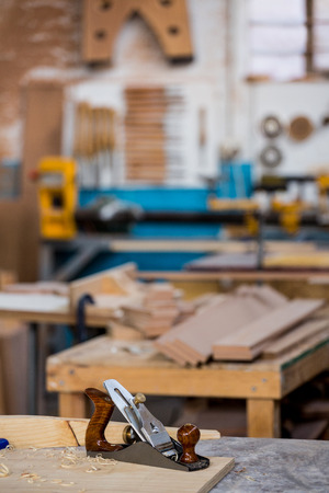 Tools and equipment used for carpentry in a dusty workshopの写真素材