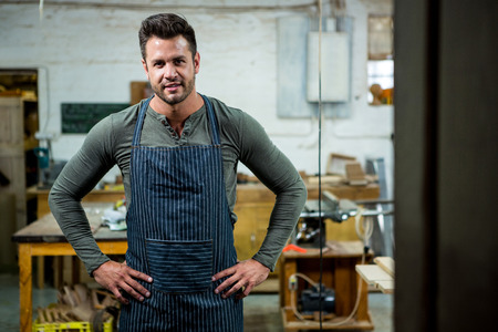 Carpenter smiling on his workshopの写真素材