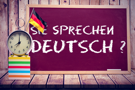 Digitally generated german national flag against wooden planksの写真素材