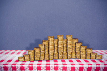 Gold coins against grey background