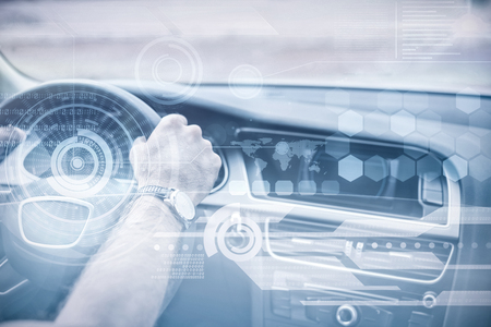 Technology interface against man driving with satellite navigation systemの写真素材