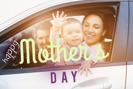 mothers day greeting against happy family posing togetherの写真素材