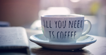 all you need is coffee against steaming cup of coffeeの写真素材