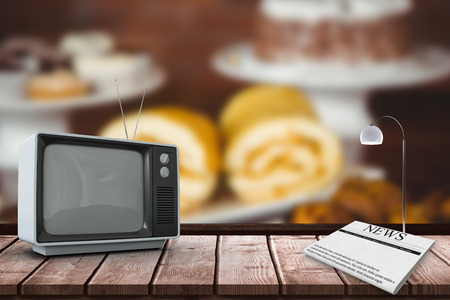 An old TV against several treats on the counterの写真素材