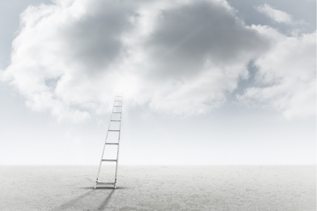 A ladder against cloudy sky backgroundの写真素材