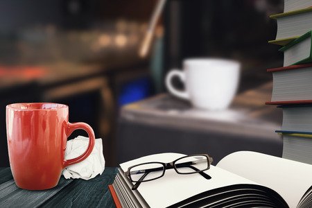 White coffee mug against school suppliesの写真素材