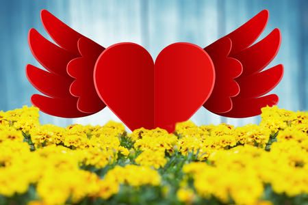 Heart with wings against a wallの写真素材