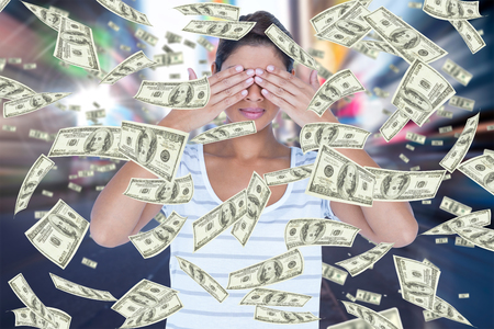 Beautiful woman covering eyes against blurry new york streetの写真素材