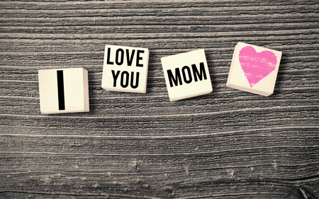 A pink heart against mothers day greetingの写真素材