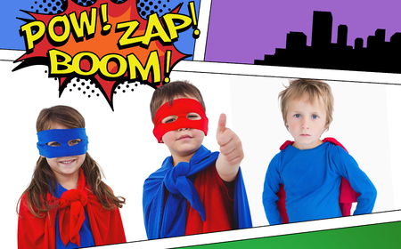 Children dressed as superhero against the words pow, zap and boomの写真素材