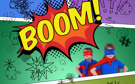 Masked kids pretending to be superheroes against the word boomの写真素材