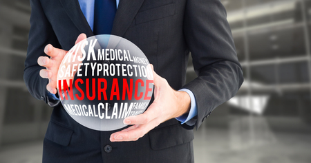 Mid section of a businessman presenting with his hands against inside a roomの写真素材