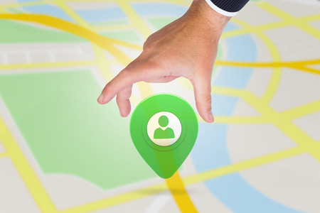 Businessman pointing with his finger against green application symbolの写真素材