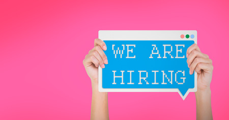 Hand showing card against pink backgroundの写真素材