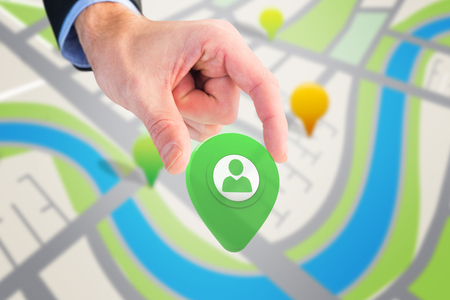 Businessman measuring something with these fingers against green application symbolの写真素材