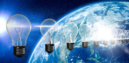 A row of light bulbs against aerial view of the earth