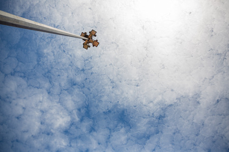 Low angle view of floodlight against cloudy skyの写真素材