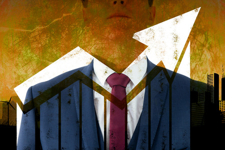 Serious businessman looking at top  against artistic cityscape designの写真素材