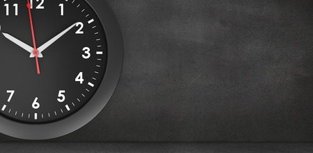 Black clock against black wall