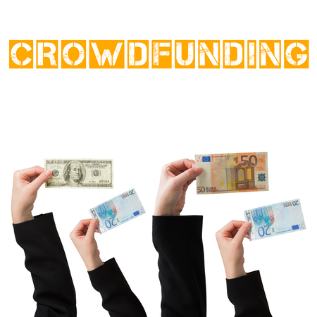 Businesswomans hand holding fifty euro notes against the word crowdfunding