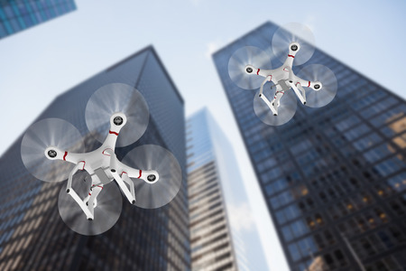 Image of a drone against skyscraperの写真素材
