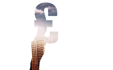 Hand holding pound sign against aerial view of a city on a cloudy dayの写真素材