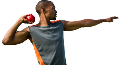 Profile view of sportsman practising shot putの写真素材