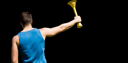 Rear view of sportsman holding a cupの写真素材