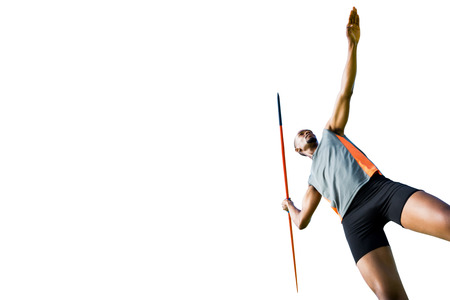 Low angle view of athletic man preparing his javelin throwの写真素材