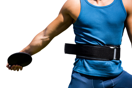 Close up on sportsman chest practising discus throwの写真素材