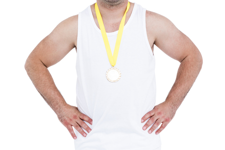Close-up of athlete with a medal on white backgroundの写真素材