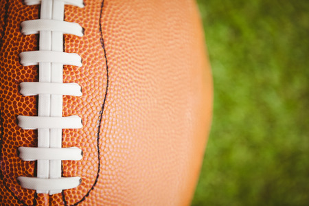Close up of rugby ball on fieldの写真素材
