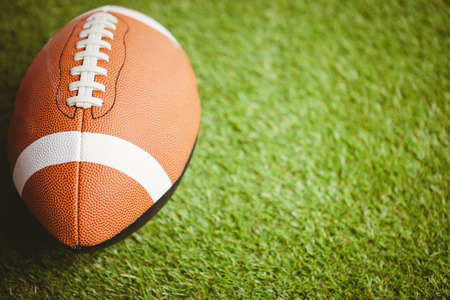 Close up of rugby ball on field