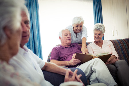 Seniors looking at pictures in the retirement house