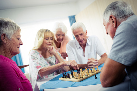 Group of seniors playing chess in the retirement houseの写真素材