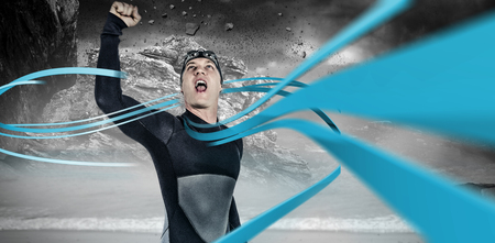 Swimmer posing after victory against rock crashing down from cliff
