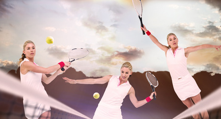 Athlete playing tennis with a racket  against composite image of landscapeの写真素材