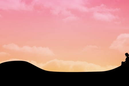 Composite image of woman figure is sitting in front of a pink skyの写真素材