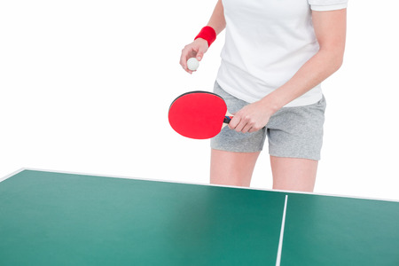 Female athlete playing table tennis on white backgroundの写真素材