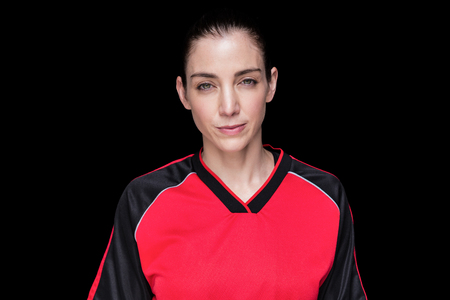 Female athlete posing on black backgroundの写真素材